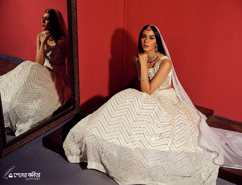 Bridal lehenga inside the Shesher Kobita boutique